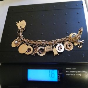 vintage 14k gold heavy bracelet with 17 charms weighs 1.6 oz